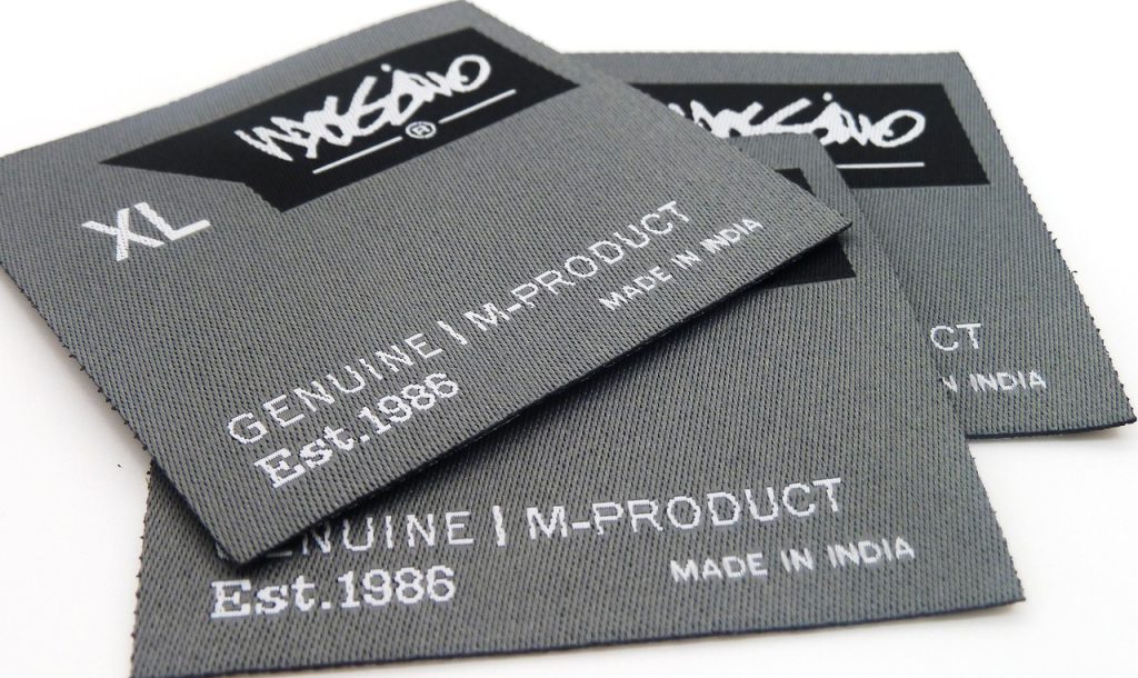label, clothing label, woven label, tag, gray clothes, clothing label, clothing label, woven label, woven label, woven label, woven label, woven label
